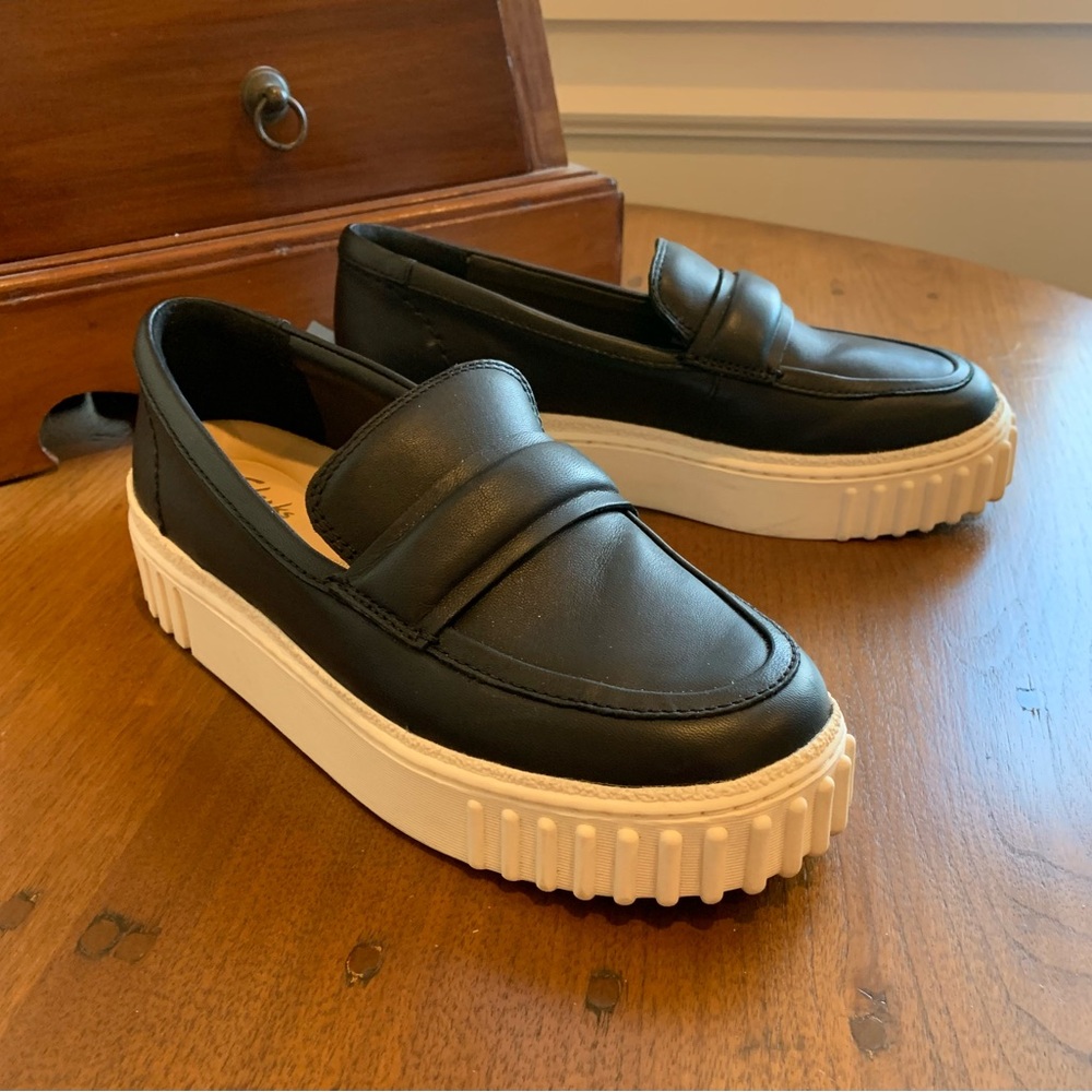 Like New, Clark’s black loafers with white lug soles.